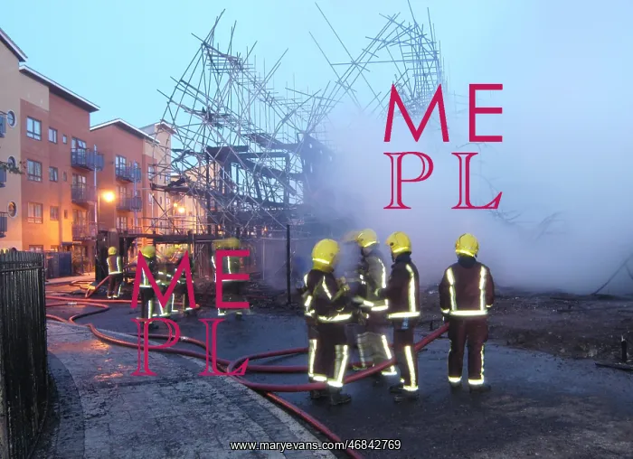 : Firefighters working at fire on building site : Firefighters working at fire on building site