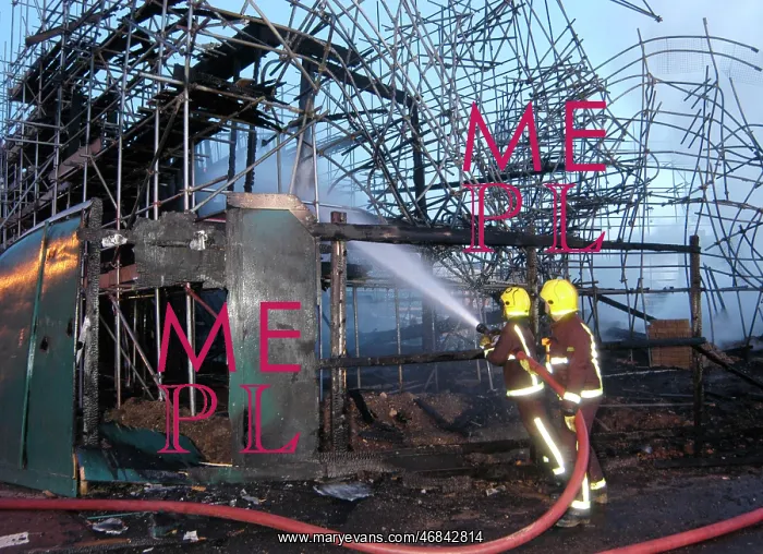 : Firefighters working at fire on building site : Firefighters working at fire on building site