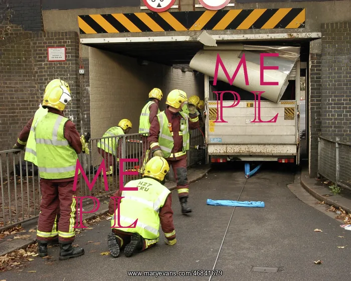 : Firefighters working to remove van trapped under bridge : Firefighters working to remove van trapped under bridge