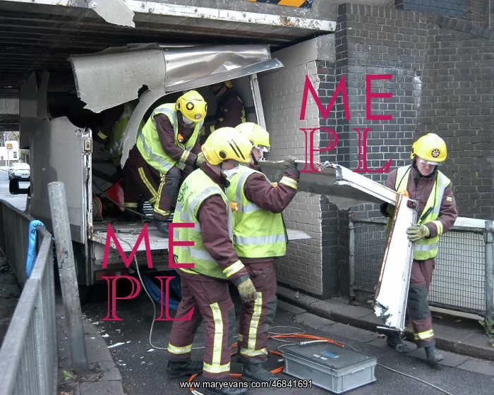 : Firefighters working to remove van trapped under bridge : Firefighters working to remove van trapped under bridge