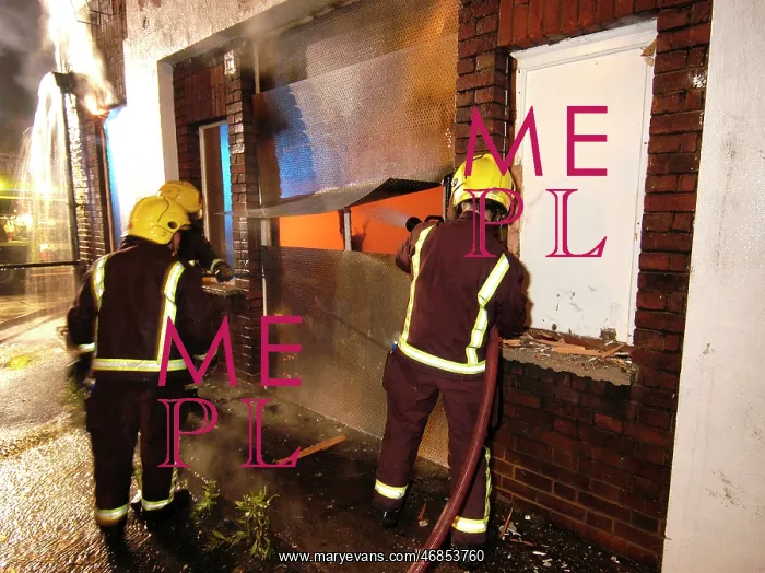 : Firefighters working at scene of pub fire : Firefighters working at scene of pub fire