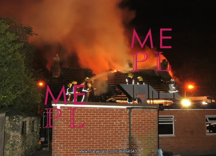 : Firefighters working at scene of restaurant fire : Firefighters working at scene of restaurant fire