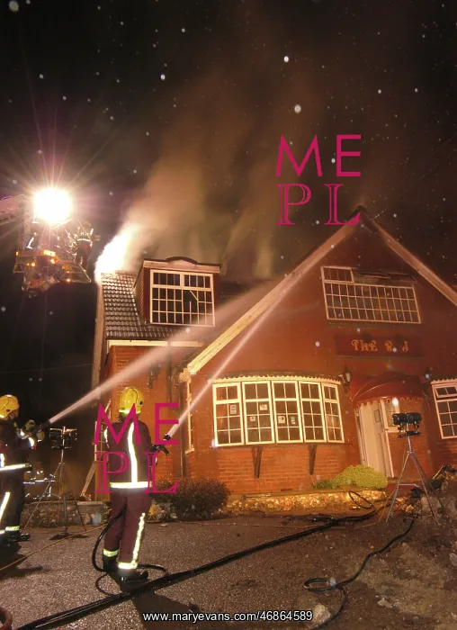 : Firefighters working at scene of restaurant fire : Firefighters working at scene of restaurant fire