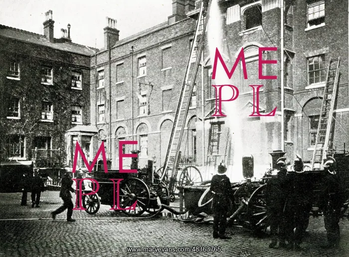  : Firemen and fire engine at work in London