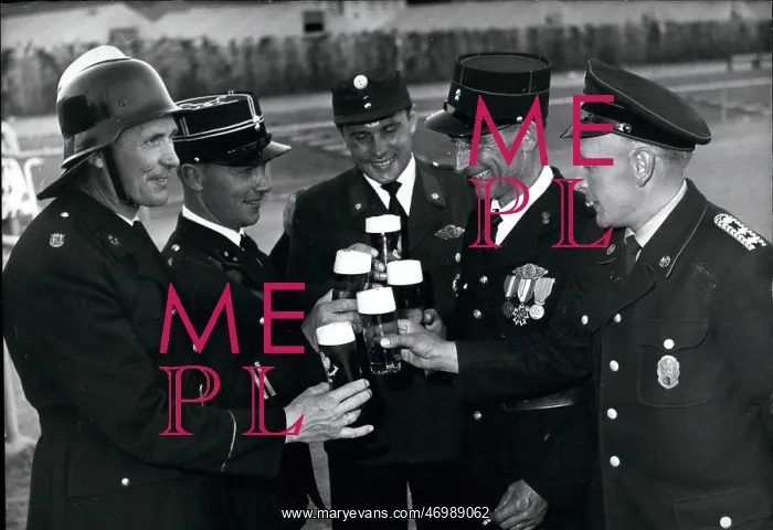 : Firemen from various countries enjoy glasses of beer : Firemen from various countries enjoy glasses of beer