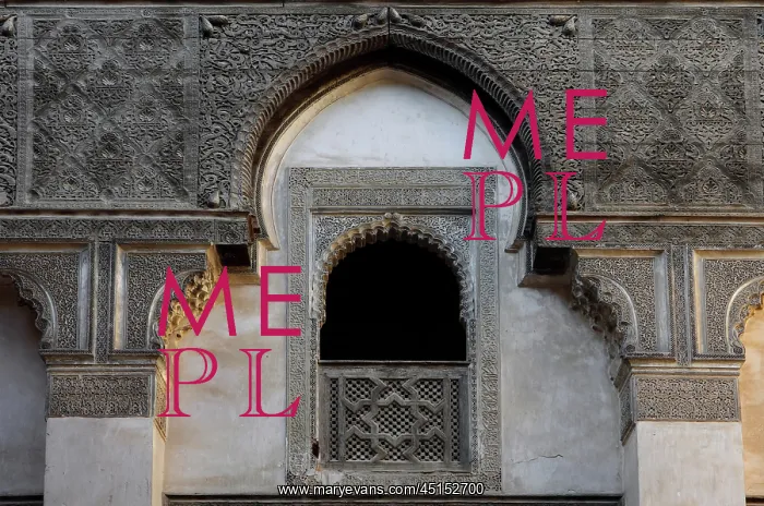 : Fez. Detail of first floor window overlooking central courtyard, Sahrij Medersa, : Fez. Detail of first floor window overlooking central courtyard, Sahrij Medersa,