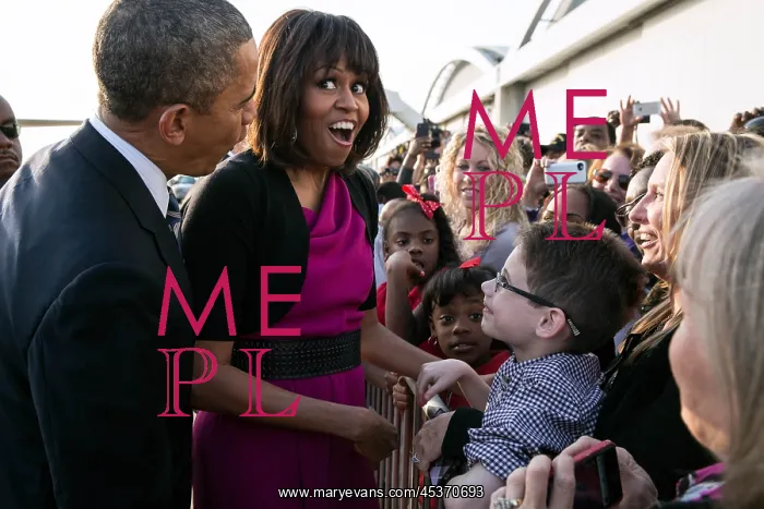 : First Lady Michelle Obama reacts while talking with : First Lady Michelle Obama reacts while talking with