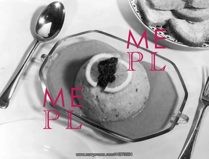 : FISH CAKE. Fish cake in sauce, garnished with lemon : FISH CAKE. Fish cake in sauce, garnished with lemon