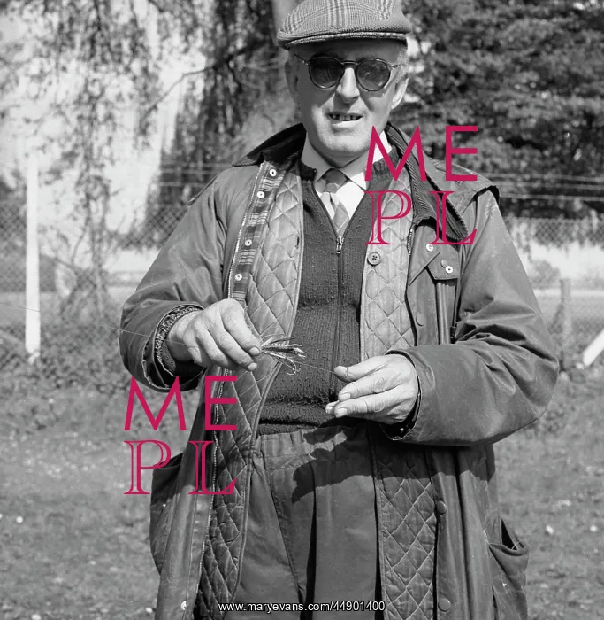 : Fisherman with man-made fly : Fisherman with man-made fly