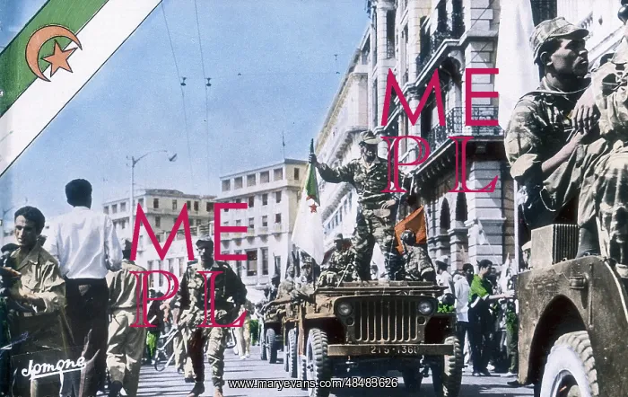 : FLN troops parade through Algiers during the Algerian : FLN troops parade through Algiers during the Algerian