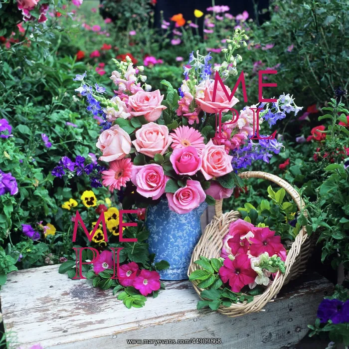 : Flower arrangement with roses in garden setting : Flower arrangement with roses in garden setting