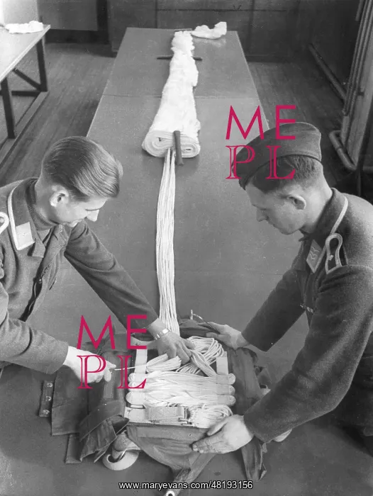 : Folding up a parachute in the parachuting school in Stendal : Folding up a parachute in the parachuting school in Stendal