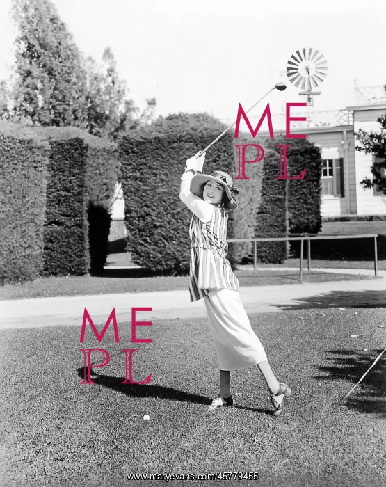  : Following through on her swing