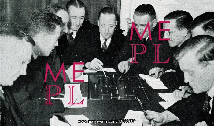 : Football referees studying the rules of the game : Football referees studying the rules of the game