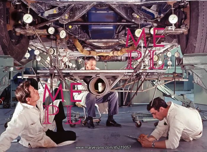 : Ford test engineers take readings on a car ? : Ford test engineers take readings on a car ?