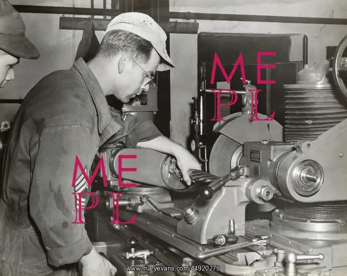 : A Foreman and an Airman Check a Grinding Machine at the ? : A Foreman and an Airman Check a Grinding Machine at the ?