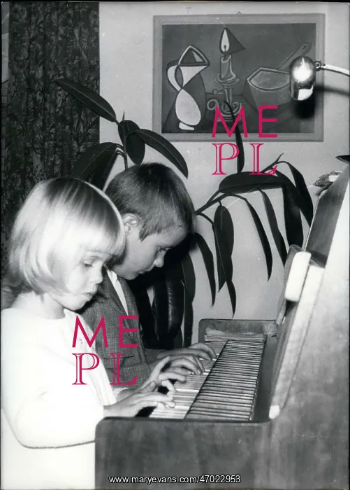 : Frank-Albert and sister Mara playing the piano : Frank-Albert and sister Mara playing the piano