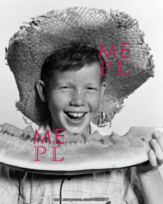 : Freckle-faced boy wearing straw hat eating large : Freckle-faced boy wearing straw hat eating large