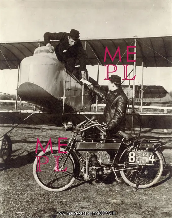 : A French Moto cyclist despatch rider hands over a despatch : A French Moto cyclist despatch rider hands over a despatch