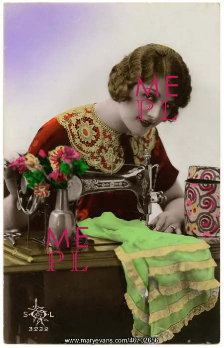 : French woman using a sewing machine : French woman using a sewing machine