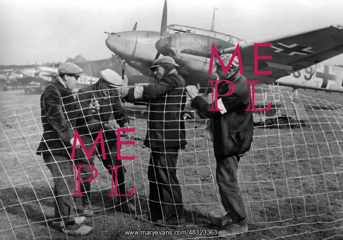 : French workers on an airfield, 1941 : French workers on an airfield, 1941