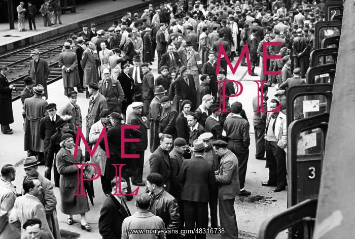 : French workers on a train platform, 1943 : French workers on a train platform, 1943