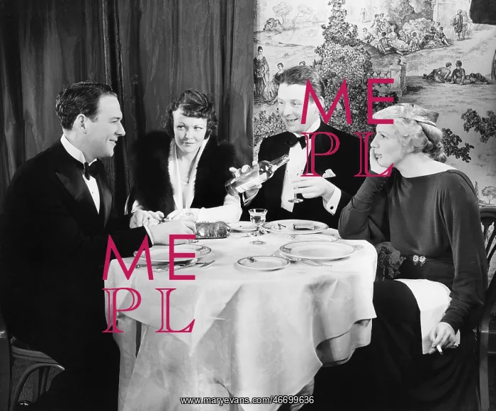 : Friends sitting together at a dinner table : Friends sitting together at a dinner table