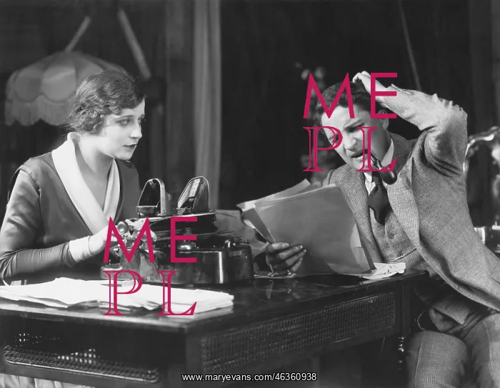 : Frowning manager reviewing secretary's work : Frowning manager reviewing secretary's work