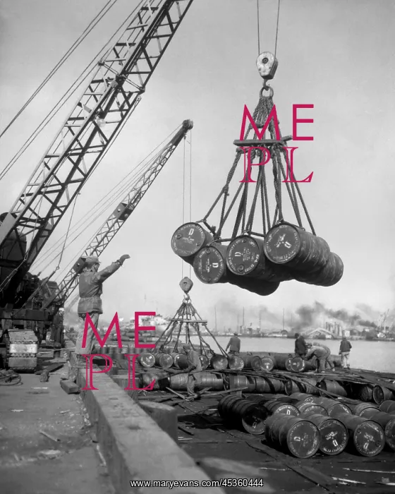 : Fuel drums are lifted and moved with cranes from : Fuel drums are lifted and moved with cranes from