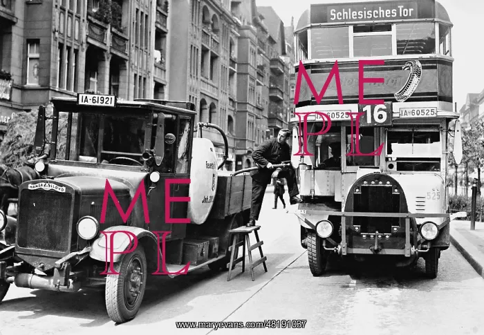 : Fueling a double decker bus in Berlin, 1932 : Fueling a double decker bus in Berlin, 1932