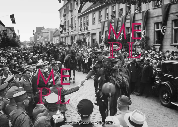 : A functionary (Gauleiter) of NSDAP welcomes a german officer : A functionary (Gauleiter) of NSDAP welcomes a german officer