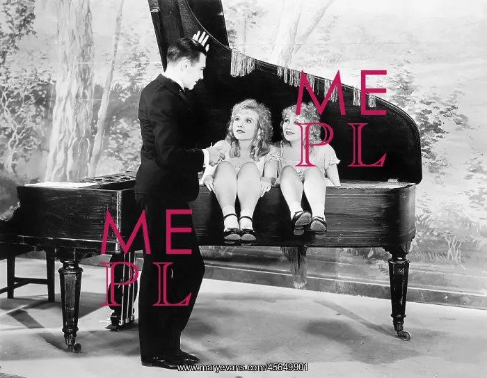 : Funny image of twins sitting inside of a piano talking : Funny image of twins sitting inside of a piano talking