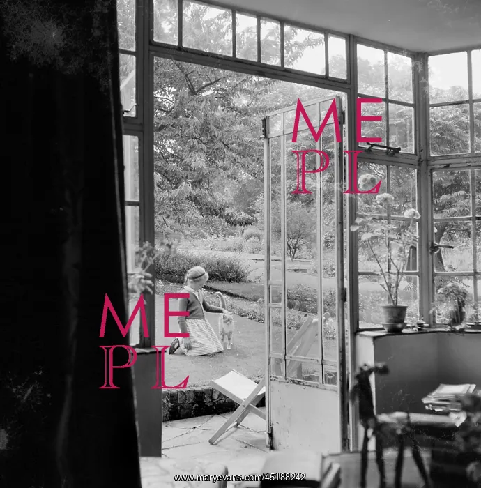 : Garden. A view looking through the French doors out towards a young girl : Garden. A view looking through the French doors out towards a young girl
