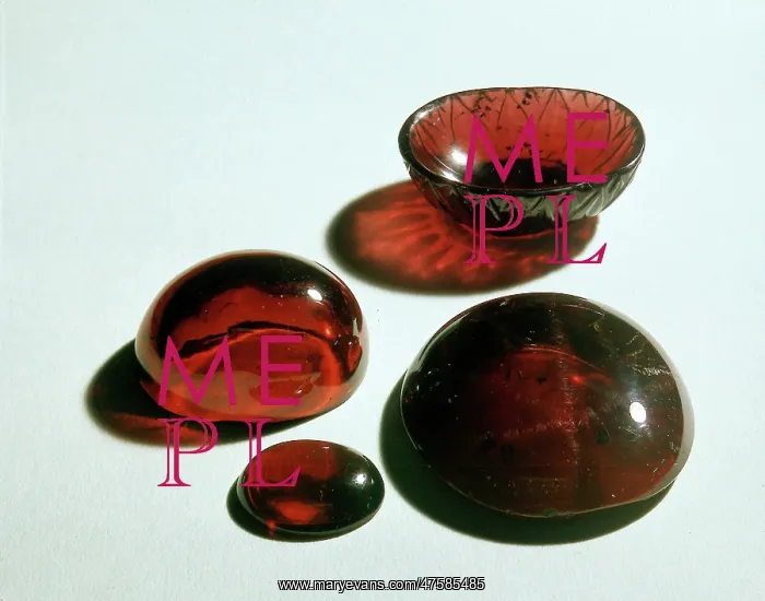 : Garnet. Almandine (iron aluminium silicate) garnet carbuncles and a dish : Garnet. Almandine (iron aluminium silicate) garnet carbuncles and a dish