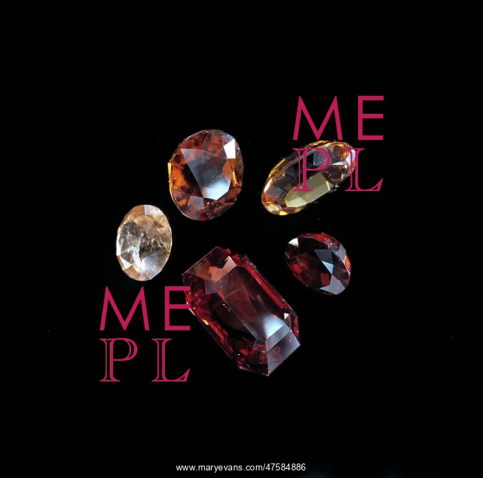 : Garnets. Faceted garnets showing a range of colours. Garnet is the birthstone of January : Garnets. Faceted garnets showing a range of colours. Garnet is the birthstone of January