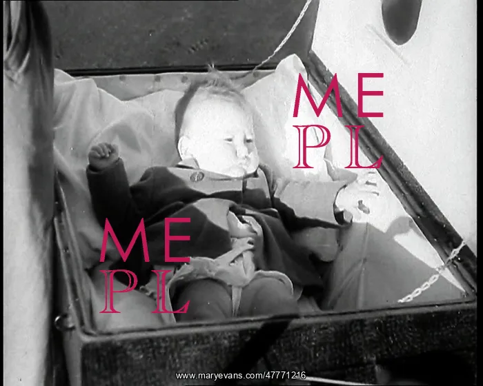 : A Gas Proof Pram With the Lid Open and a Baby : A Gas Proof Pram With the Lid Open and a Baby