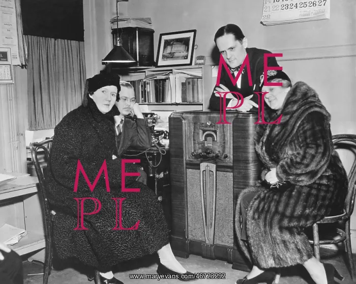 : Gathered around the radio : Gathered around the radio