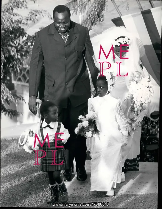 : General Amin of Uganda with bride and two children : General Amin of Uganda with bride and two children