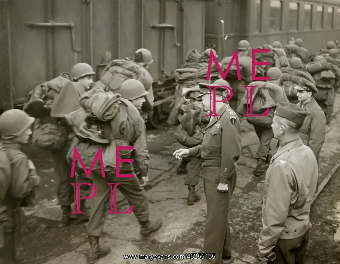 : General Dwight Eisenhower greets GI's loaded down : General Dwight Eisenhower greets GI's loaded down