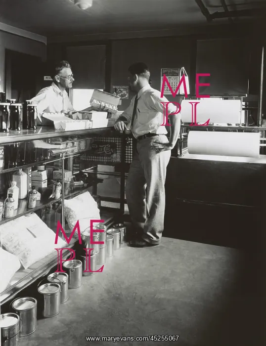 : General store shopkeeper and customer, Ohio, Aug : General store shopkeeper and customer, Ohio, Aug