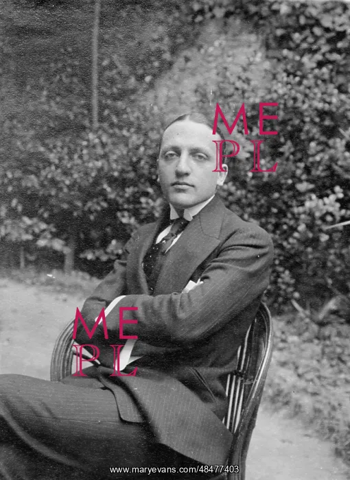  : Gentleman sitting on a chair outside