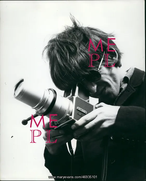 : George Harrison of The Beatles pop group with camera : George Harrison of The Beatles pop group with camera