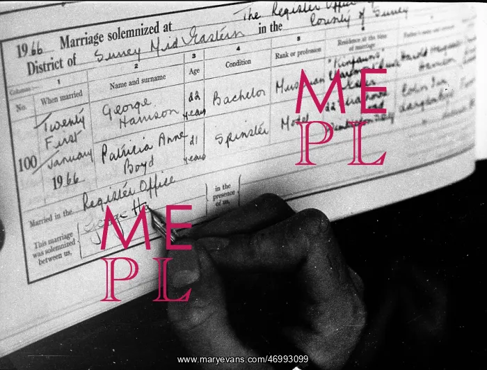 : George Harrison signing his marriage certificate : George Harrison signing his marriage certificate