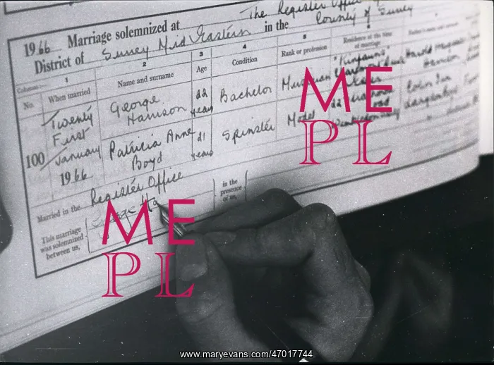 : George Harrison signing his marriage certificate : George Harrison signing his marriage certificate