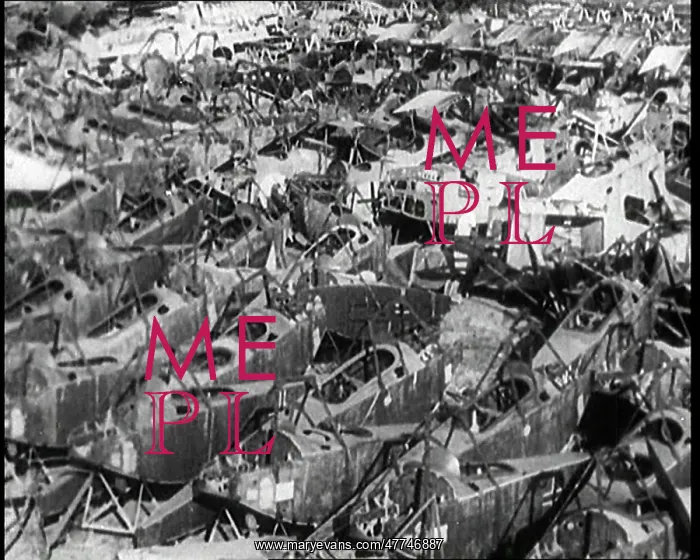 : German Biplanes Piled High in a Scrapyard To : German Biplanes Piled High in a Scrapyard To