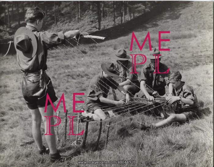 : German boy scouts with camp loom : German boy scouts with camp loom
