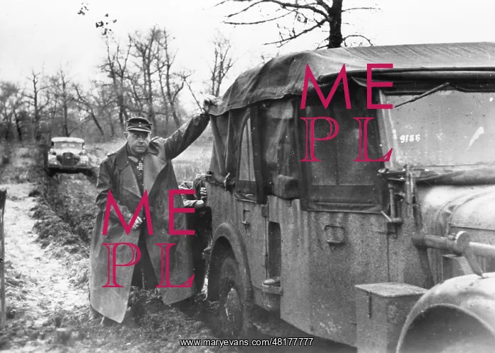 : A German general pushes his car on the Eastern Front, 1944 : A German general pushes his car on the Eastern Front, 1944