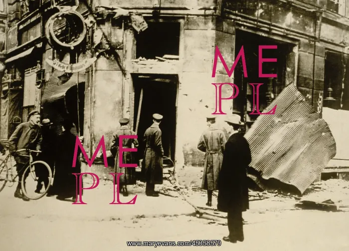 : German men standing in front of a destroyed police : German men standing in front of a destroyed police