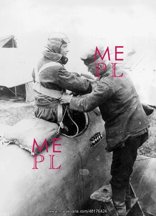 : German pilot climbs into his machine, 1918 : German pilot climbs into his machine, 1918