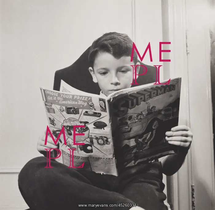 : German refugee boy reading a Superman comic at : German refugee boy reading a Superman comic at